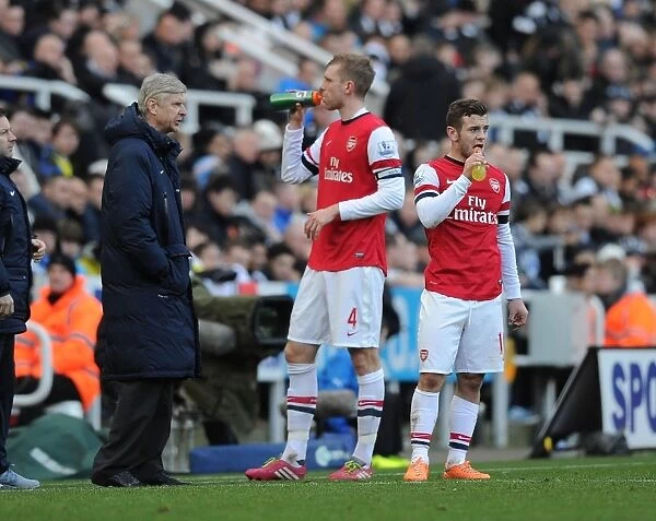 Arsene Wenger Gives Instructions to Jack Wilshere and Per Mertesacker during Newcastle United vs Arsenal (2013-14)