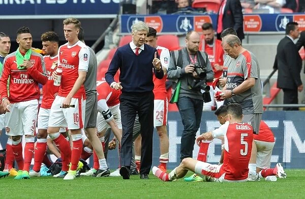 Arsene Wenger Giving Last-Minute Instructions to Gabriel before Arsenal's FA Cup Semi-Final vs Manchester City