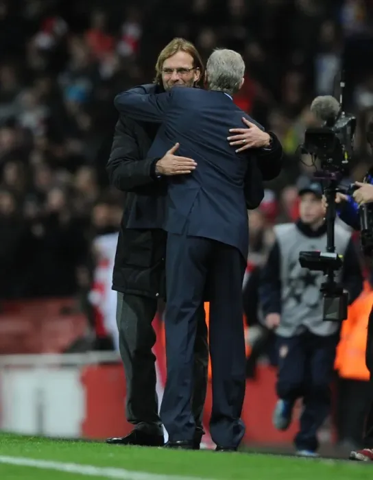 Framed Print : Arsene Wenger and Jurgen Klopp: A Heartfelt Embrace After Arsenal vs. Borussia Dortmund in the Champions League (2011) Framed Print : Arsene Wenger and Jurgen Klopp: A Heartfelt Embrace After Arsenal vs. Borussia Dortmund in the Champions League (2011)