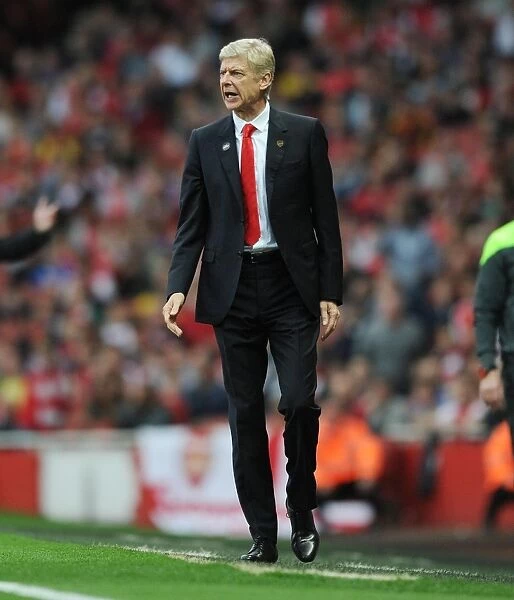 Arsene Wenger Leads Arsenal Against Hull City in Premier League Action