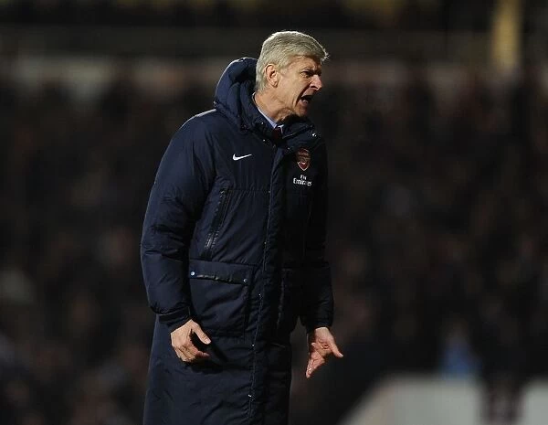 Arsene Wenger Leads Arsenal Against West Ham United in Premier League Clash (2013-14)
