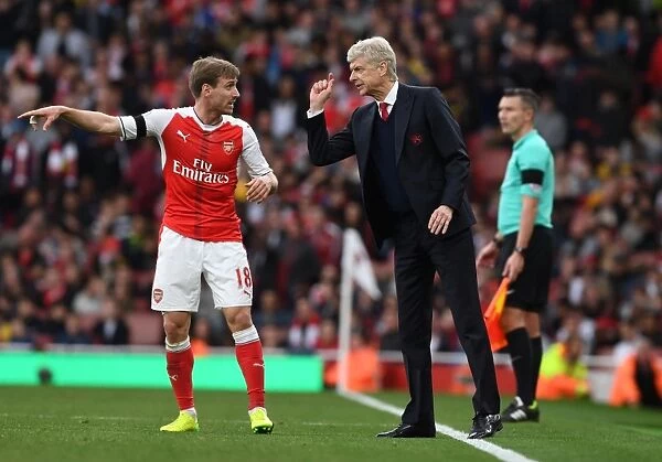 Arsene Wenger and Nacho Monreal: A Focused Duo During Arsenal vs Manchester City, Premier League 2016-17