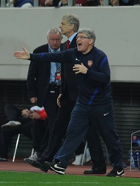 Arsene Wenger and Pat Rice Lead Arsenal in Champions League Clash against Olympiacos (December 2011)
