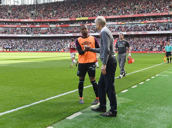 Arsene Wenger and Patrice Evra Clash During Arsenal vs. West Ham United Premier League Match