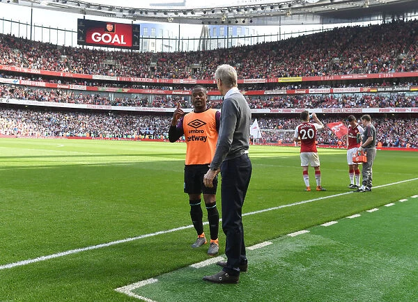 Arsene Wenger and Patrice Evra: A Tense Moment during Arsenal vs. West Ham United