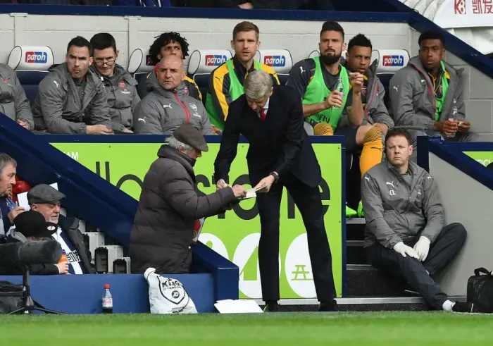 Framed Print : Arsene Wenger Signs Autograph for West Brom Fan during Arsenal's Premier League Match Framed Print : Arsene Wenger Signs Autograph for West Brom Fan during Arsenal's Premier League Match