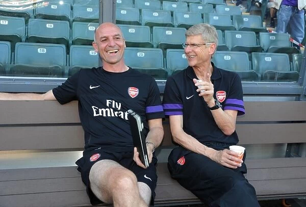Arsene Wenger and Steve Bould: A Light-Hearted Moment Before Arsenal's Pre-Season Friendly against Kitchee (2012)