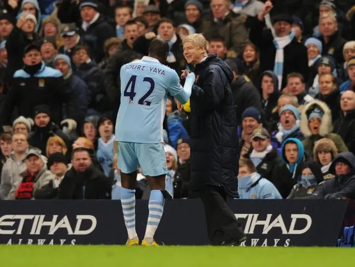 Framed Print : Arsene Wenger and Yaya Toure: A Moment of Camaraderie Amidst Rivalry (Manchester City vs Arsenal, 2011-12)
