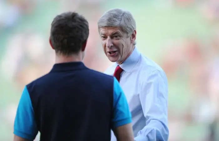 Framed Print : Arsene Wenger's Light-Hearted Moment with Aaron Ramsey during Udinese v Arsenal, UEFA Champions League Play-Off (2011)