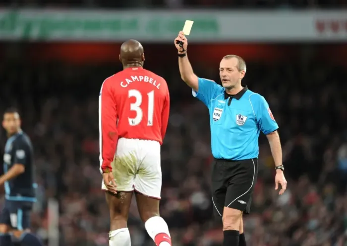 Framed Print : Arsenla defender Sol Campbell is shown the yellow card by referee Martin Atkinson Framed Print : Arsenla defender Sol Campbell is shown the yellow card by referee Martin Atkinson