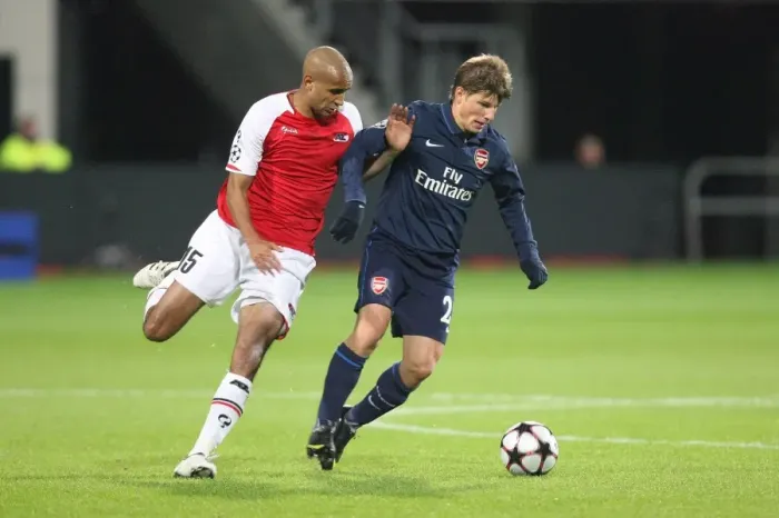 Framed Print : Arshavin vs. Poulsen: 1-1 Stalemate in the Champions League Clash between AZ Alkmaar and Arsenal, October 2009 Framed Print : Arshavin vs. Poulsen: 1-1 Stalemate in the Champions League Clash between AZ Alkmaar and Arsenal, October 2009
