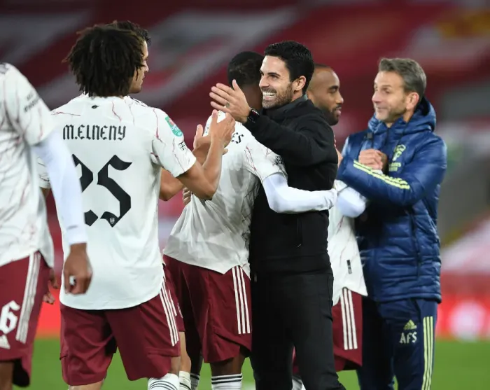 Framed Print : Arteta Embraces Maitland-Niles: Carabao Cup Battle at Empty Anfield - Liverpool vs. Arsenal, 2020
