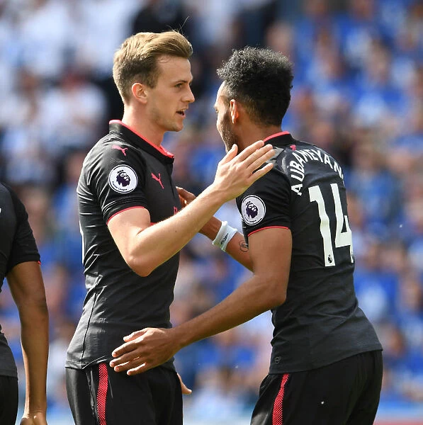 Aubameyang and Holding Celebrate Arsenal's Goal Against Huddersfield Town