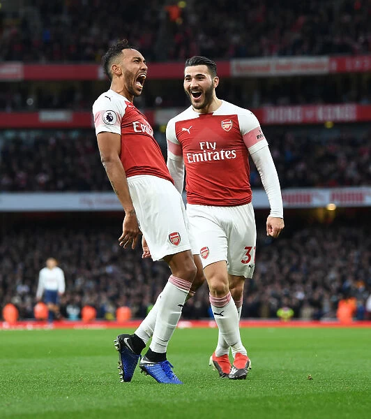 Aubameyang and Kolasinac Celebrate Arsenal's Winning Goal Against Tottenham