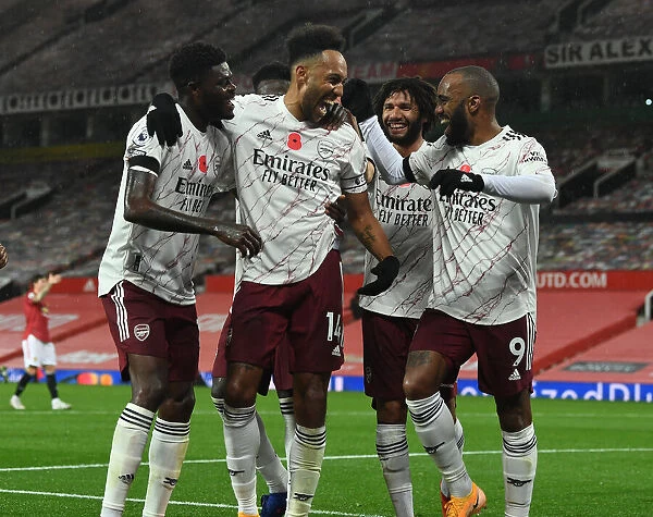 Aubameyang, Lacazette, and Partey Celebrate Arsenal's Goal Against Manchester United (2020-21)