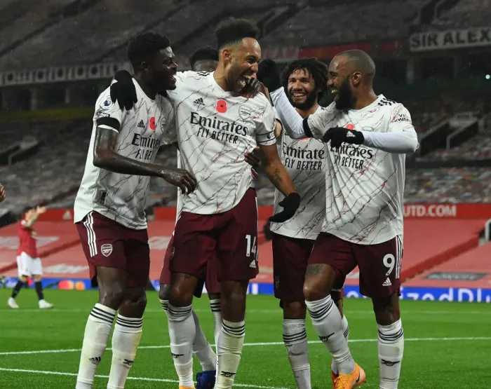 Framed Print : Aubameyang, Lacazette, and Partey Celebrate Arsenal's Goal Against Manchester United (2020-21)