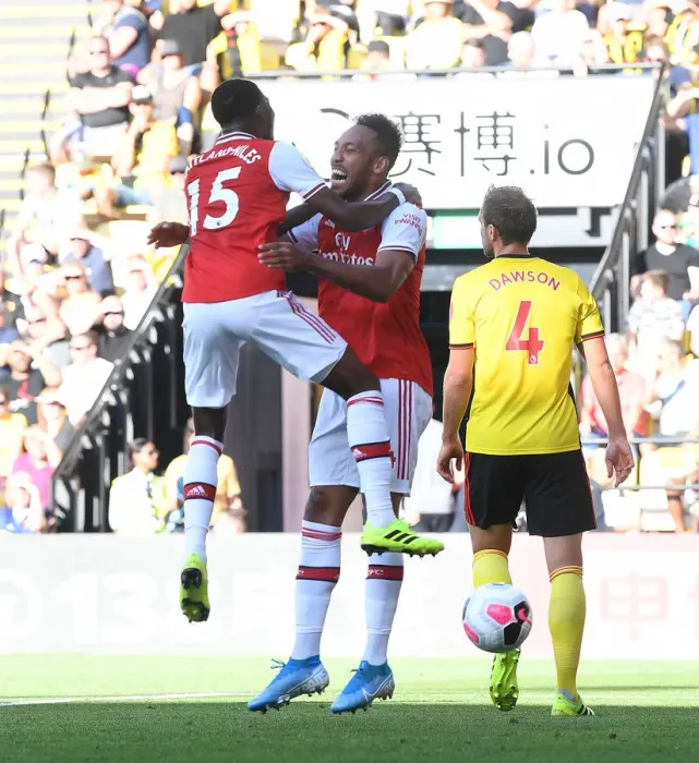 Framed Print : Aubameyang and Maitland-Niles Celebrate Arsenal's Win Against Watford (2019-20) Framed Print : Aubameyang and Maitland-Niles Celebrate Arsenal's Win Against Watford (2019-20)
