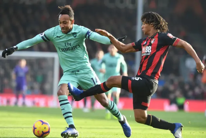 Framed Print : Aubameyang vs Ake: Intense Battle in AFC Bournemouth vs Arsenal FC Premier League Clash