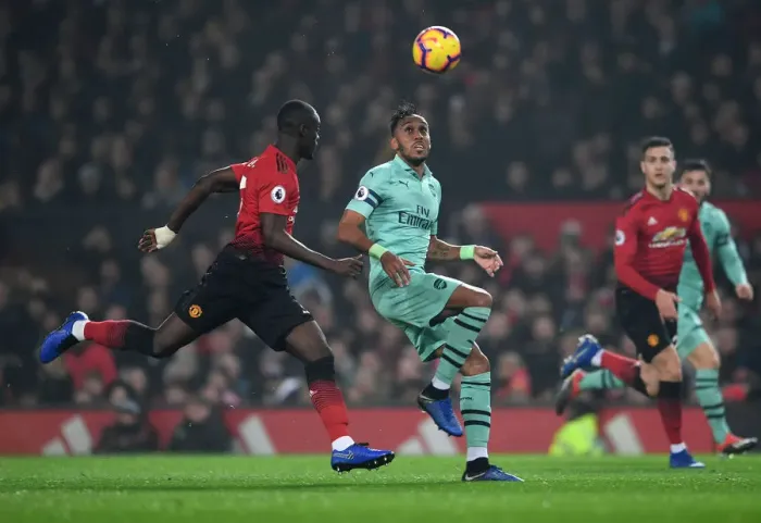 Framed Print : Aubameyang vs. Bailly: Intense Battle at Old Trafford - Manchester United vs. Arsenal FC, Premier League 2018-19