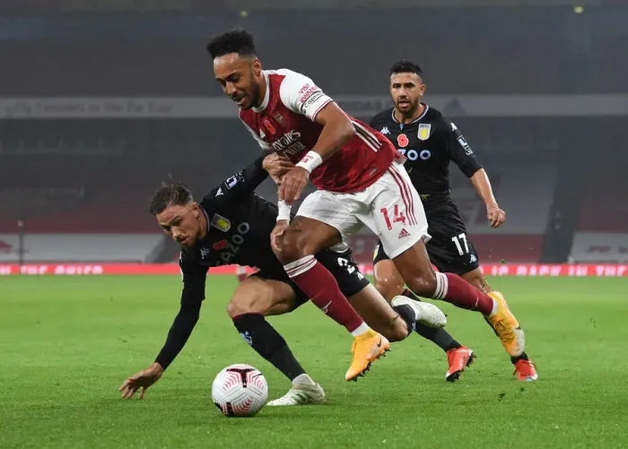 Framed Print : Aubameyang vs. Cash: Intense Battle in Arsenal vs. Aston Villa Premier League Clash