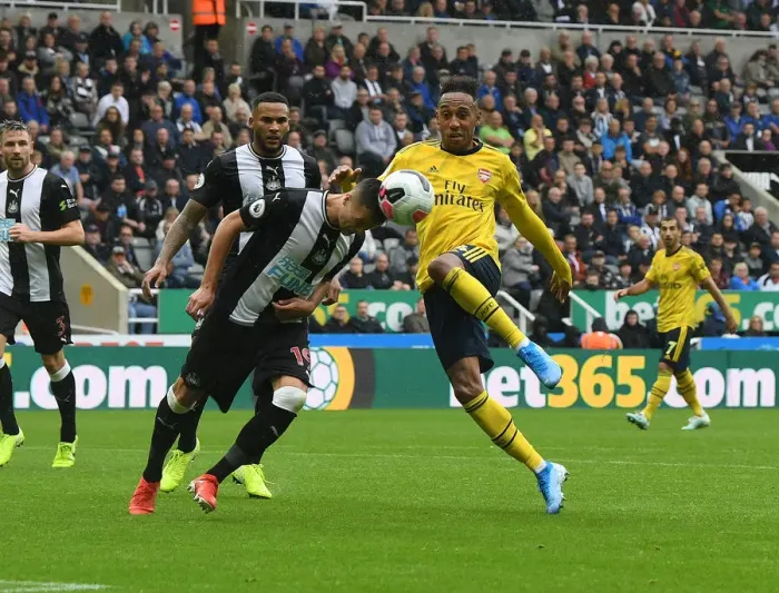 Framed Print : Aubameyang vs Manquillo: Intense Clash in Newcastle United vs Arsenal FC Premier League Match Framed Print : Aubameyang vs Manquillo: Intense Clash in Newcastle United vs Arsenal FC Premier League Match