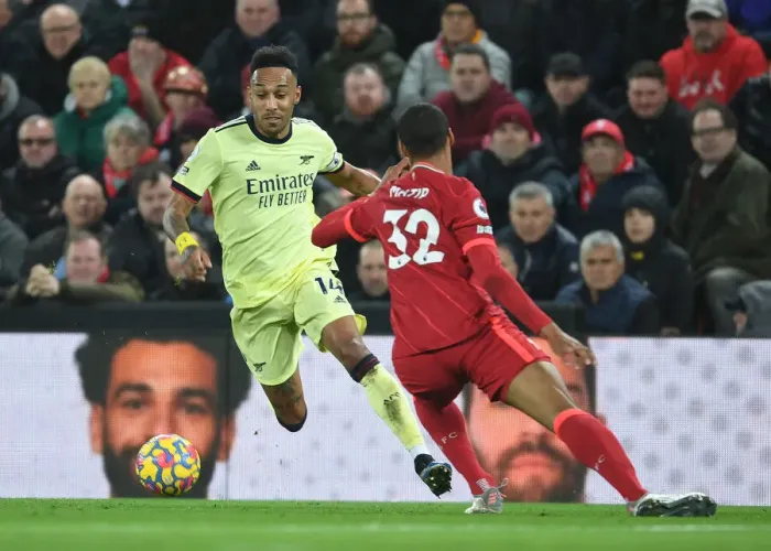 Framed Print : Aubameyang vs Matip: Intense Battle at Anfield - Liverpool vs Arsenal, Premier League 2021-22