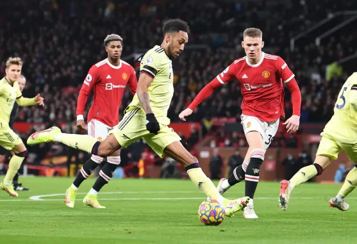 Framed Print : Aubameyang vs McTominay: Intense Moment at Old Trafford - Manchester United vs Arsenal, Premier League 2020-21