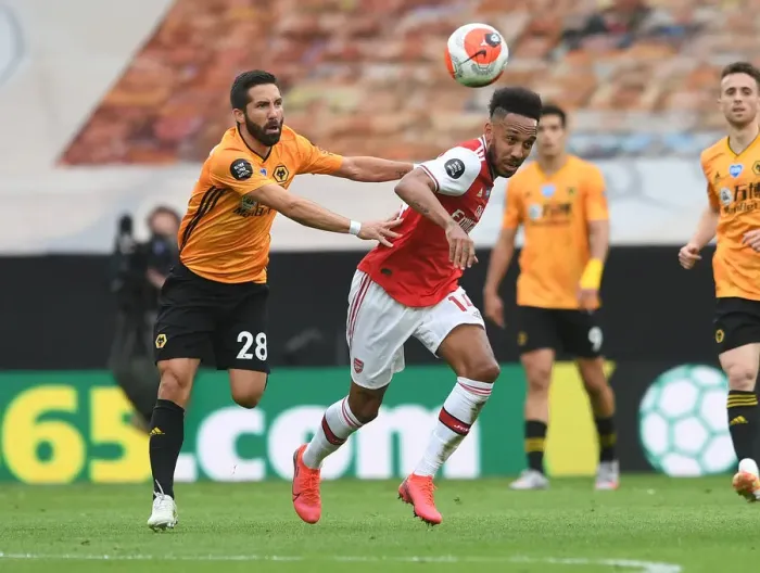 Framed Print : Aubameyang vs. Moutinho: Intense Clash Between Wolverhampton and Arsenal in Premier League