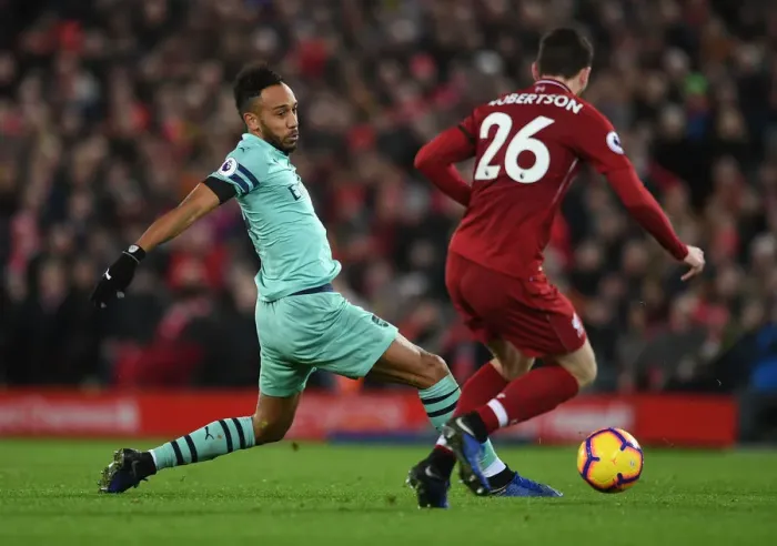 Framed Print : Aubameyang vs Robertson: Intense Battle at Anfield - Premier League 2018-19
