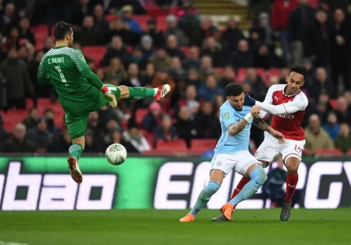 Framed Print : Aubameyang vs. Walker: A Carabao Cup Final Showdown - Arsenal's Star Forward Clashes with Manchester City's Defender