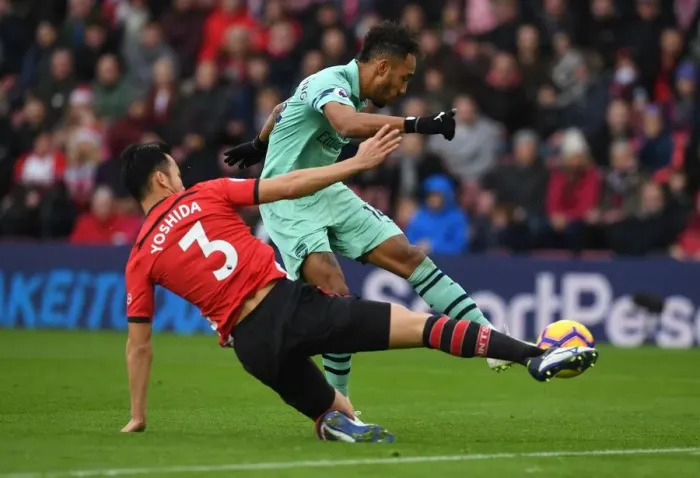 Framed Print : Aubameyang vs Yoshida: Intense Moment at Southampton's St Marys Stadium - Premier League 2018-19 Framed Print : Aubameyang vs Yoshida: Intense Moment at Southampton's St Marys Stadium - Premier League 2018-19