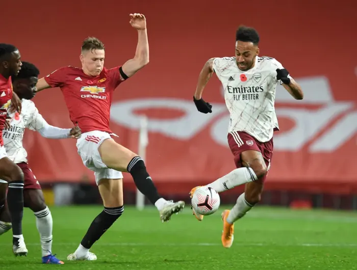 Framed Print : Aubameyang's Sneaky Move: Arsenal's Star Outwits McTominay in Manchester United vs. Arsenal, 2020-21 Premier League