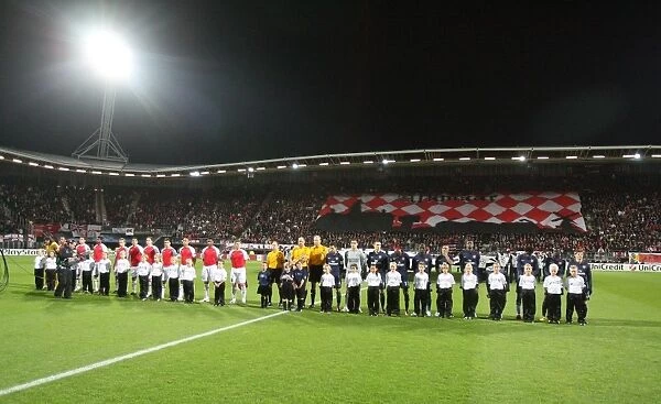 The AZ Alkmaar and Arsenal teams line up before the match