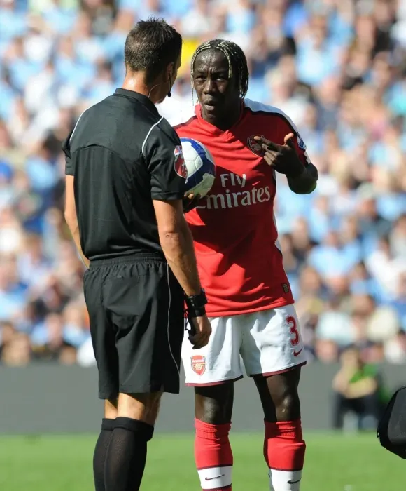 Framed Print : Bacary Sagna (Arsenal) talks with referee Mark Clattenburg