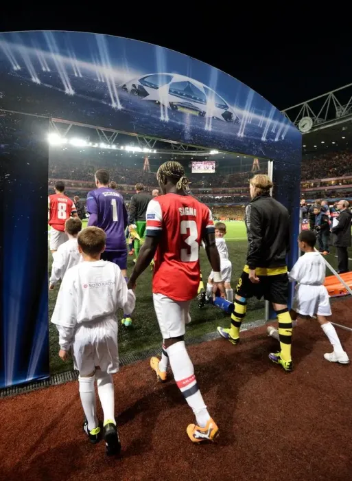 Framed Print : Bacary Sagna Leads Arsenal onto Emirates Stadium Field vs Borussia Dortmund, UEFA Champions League (2013)