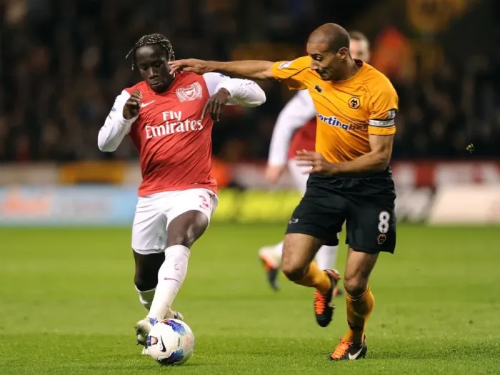 Framed Print : Bacary Sagna Outsmarts Carl Henry: A Premier League Battle at Molineux, 2012 Framed Print : Bacary Sagna Outsmarts Carl Henry: A Premier League Battle at Molineux, 2012