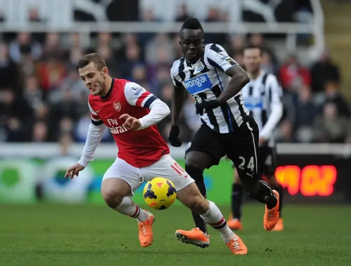 Framed Print : Battle in the Midfield: Jack Wilshere vs. Cheick Tiote (Premier League 2013-14)