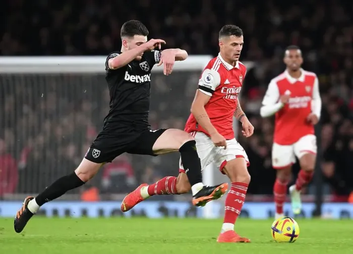 Framed Print : Battle of Midfield Titans: Xhaka vs. Rice in Arsenal vs. West Ham Premier League Showdown Framed Print : Battle of Midfield Titans: Xhaka vs. Rice in Arsenal vs. West Ham Premier League Showdown