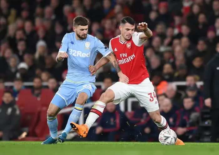 Framed Print : Battle of Midfield Titans: Xhaka vs Klich - Arsenal vs Leeds United, FA Cup Showdown