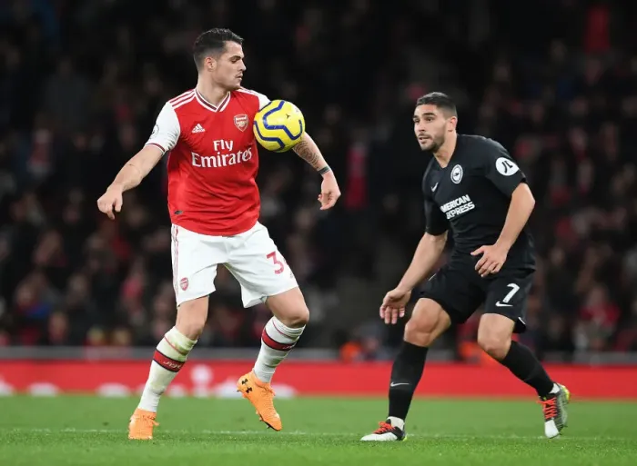 Framed Print : Battle of Midfield Titans: Xhaka vs Maupay in Arsenal vs Brighton Premier League Clash