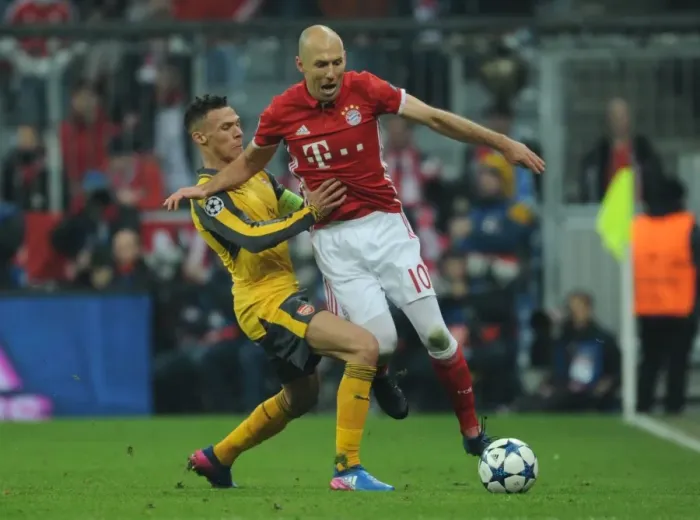 Framed Print : A Battle of Wings: Kieran Gibbs vs Arjen Robben - Arsenal vs Bayern Munich, Champions League Showdown Framed Print : A Battle of Wings: Kieran Gibbs vs Arjen Robben - Arsenal vs Bayern Munich, Champions League Showdown