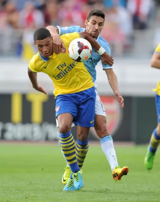 Framed Print : Battle of the Wings: Oxlade-Chamberlain vs. Navas in Arsenal's Pre-Season Clash with Manchester City, 2013