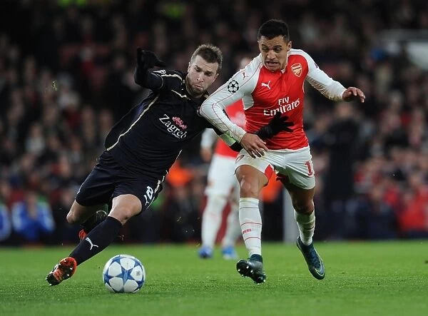 A Battle of Wits: Alexis Sanchez vs. Domagoj Antolic in Arsenal's UEFA Champions League Clash Against Dinamo Zagreb