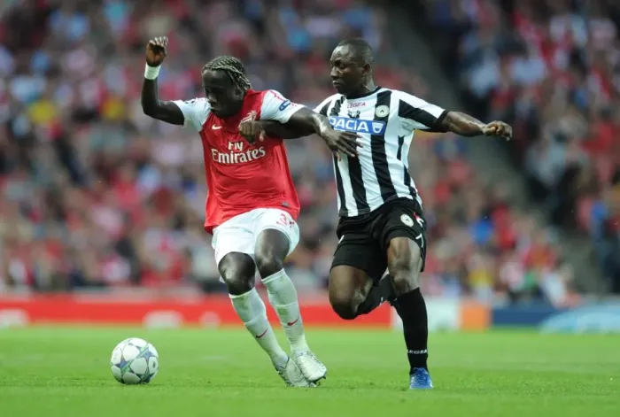 Framed Print : Battleground Emirates: Sagna Holds Off Armero in Arsenal's UEFA Champions League Clash (2011)