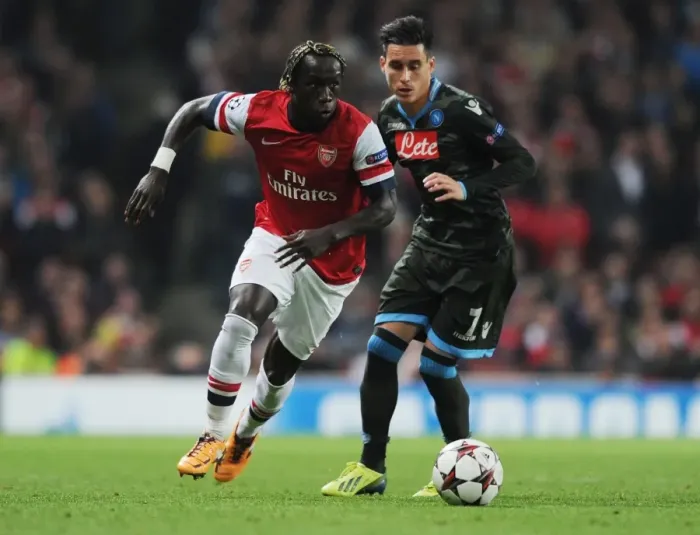 Framed Print : Battling Past Napoli: Sagna's Determined Run at Emirates Stadium (Arsenal v Napoli 2013-14) Framed Print : Battling Past Napoli: Sagna's Determined Run at Emirates Stadium (Arsenal v Napoli 2013-14)