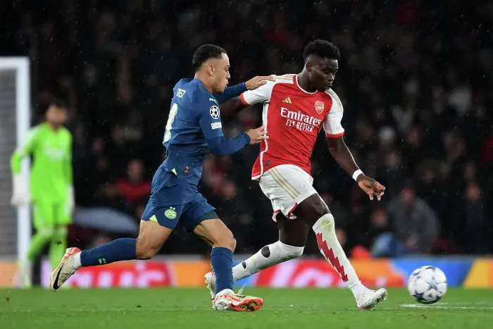 Framed Print : Battling Wings: Saka vs. Dest in Arsenal's Champions League Clash Framed Print : Battling Wings: Saka vs. Dest in Arsenal's Champions League Clash