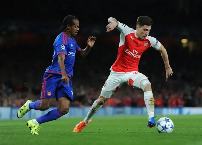 Framed Print : Bellerin vs. Salino: Clash in the Champions League between Arsenal's Hector Bellerin and Olympiacos Leandro Salino