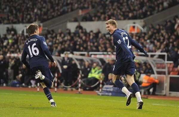 Bendtner and Ramsey: Celebrating Arsenal's First Goal in Stoke's Britanna Stadium (27 / 2 / 2010)