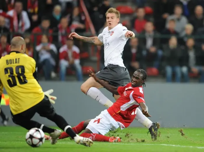 Framed Print : Bendtner Scores the Game-Winning Goal: Arsenal Triumphs 3-2 over Standard Liege in Champions League