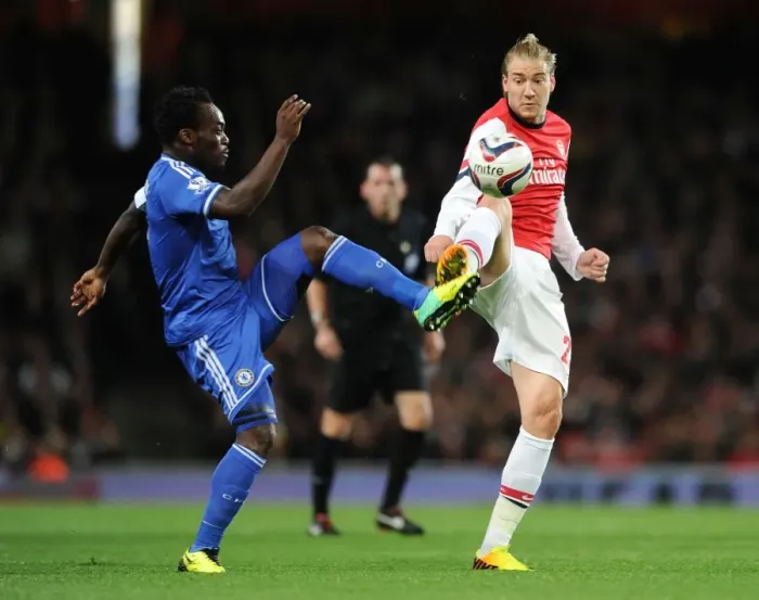 Framed Print : Bendtner vs. Essien: A Football Rivalry Ignites in the Arsenal vs. Chelsea Capital One Cup Clash